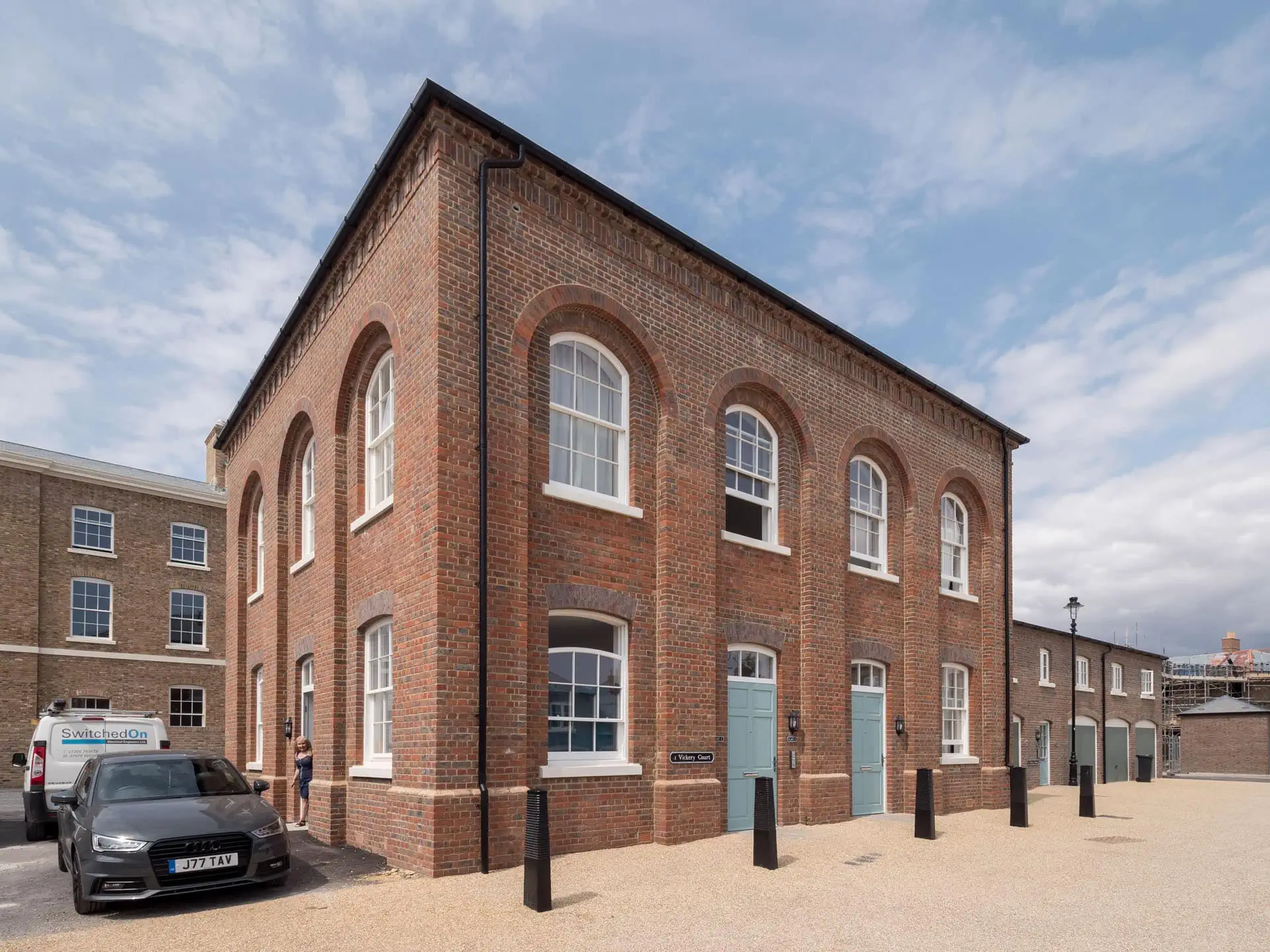 Poundbury Dorchester Clay Brick House with ccustom arches