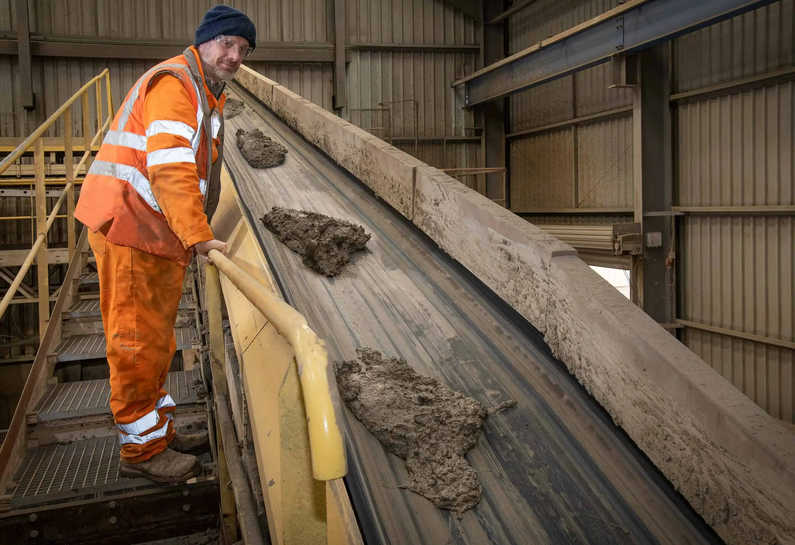 man overseeing manufacturing process